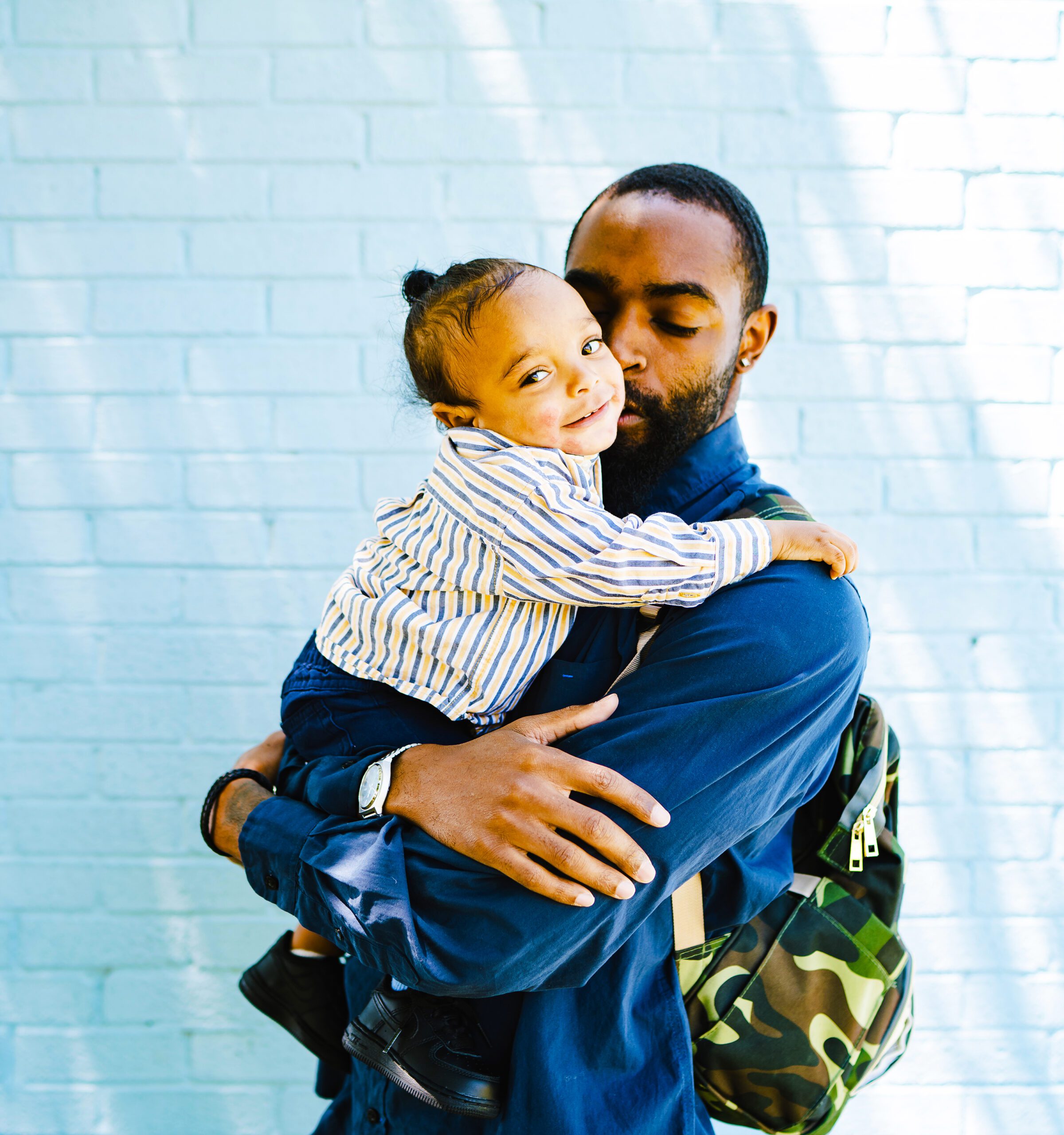 African American man holding his son